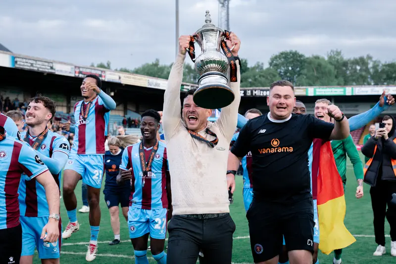 Andy Butler Lifts the Trophy